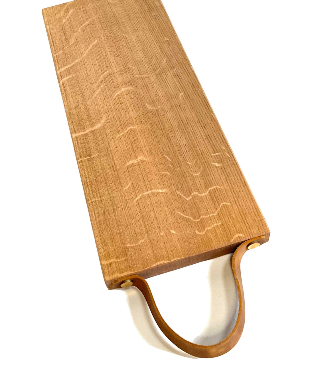 Long oak chopping / tapas board with leather strap.