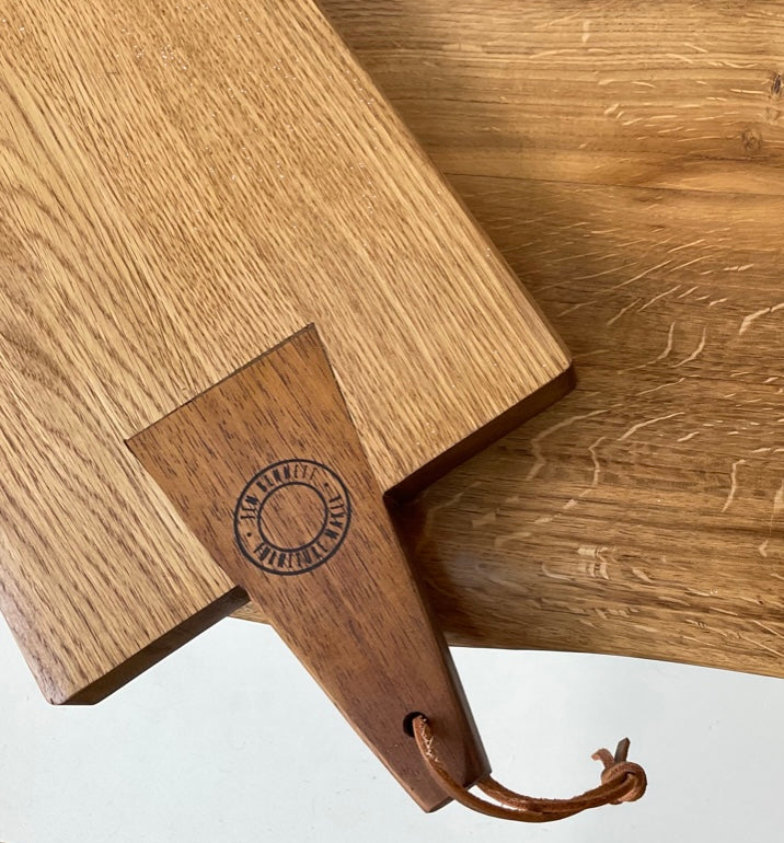Medium sized oak chopping/ serving board with contrasting handle.